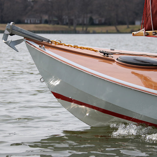 The Guider's stainless steel rubrails are seen at its bow.