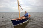 Terry Otis Sailing a Jimmy Skiff with a hat on, in the Chesapeake Bay.  Thumbnail