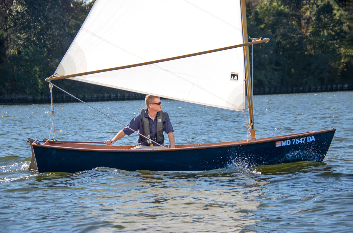 John Harris sailing the Jimmy Skiff. 