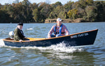 A 2-hp Honda outboard drives this Jimmy Skiff II and its two passengers. Thumbnail