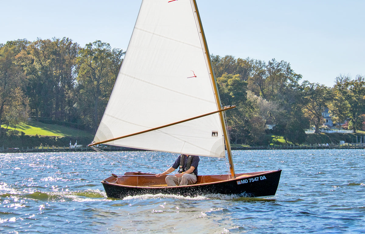 John Harris sailing the Jimmy Skiff. 