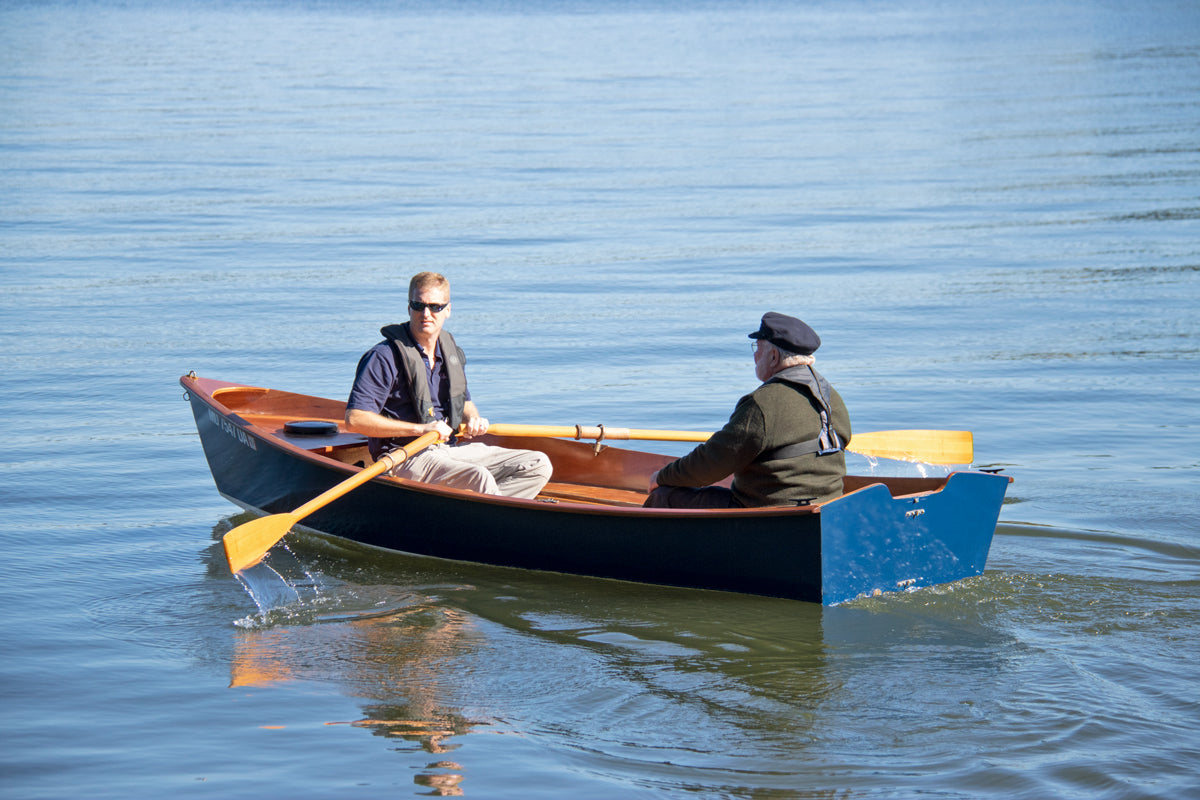 Two men rowing the CLC Jimmy Skiff.