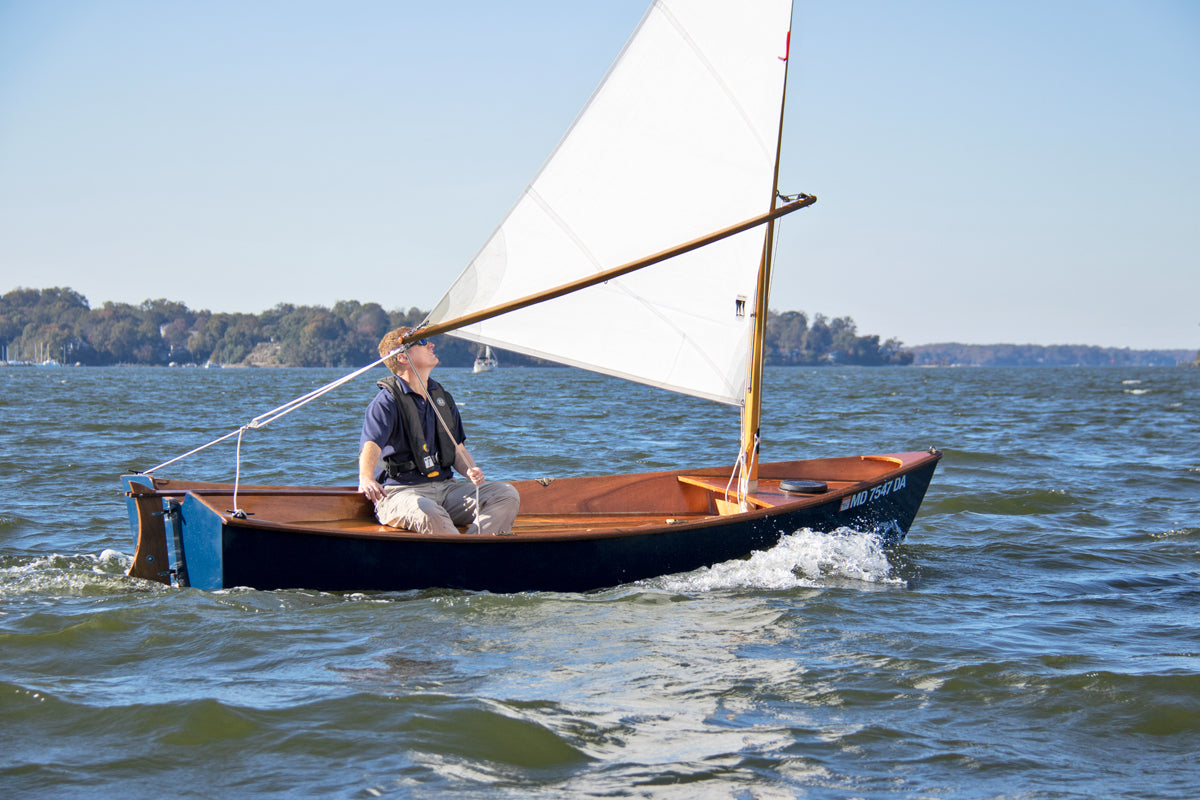 John Harris sailing a Jimmy Skiff on a gorgeous day on the Severn River in Annapolis, MD. 