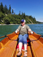 Woman rowing the CLC Jimmy Skiff.  Thumbnail
