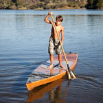 This boy is concentrating as he moves his Kaholo 12-6  paddleboard gracefully through the water. Thumbnail