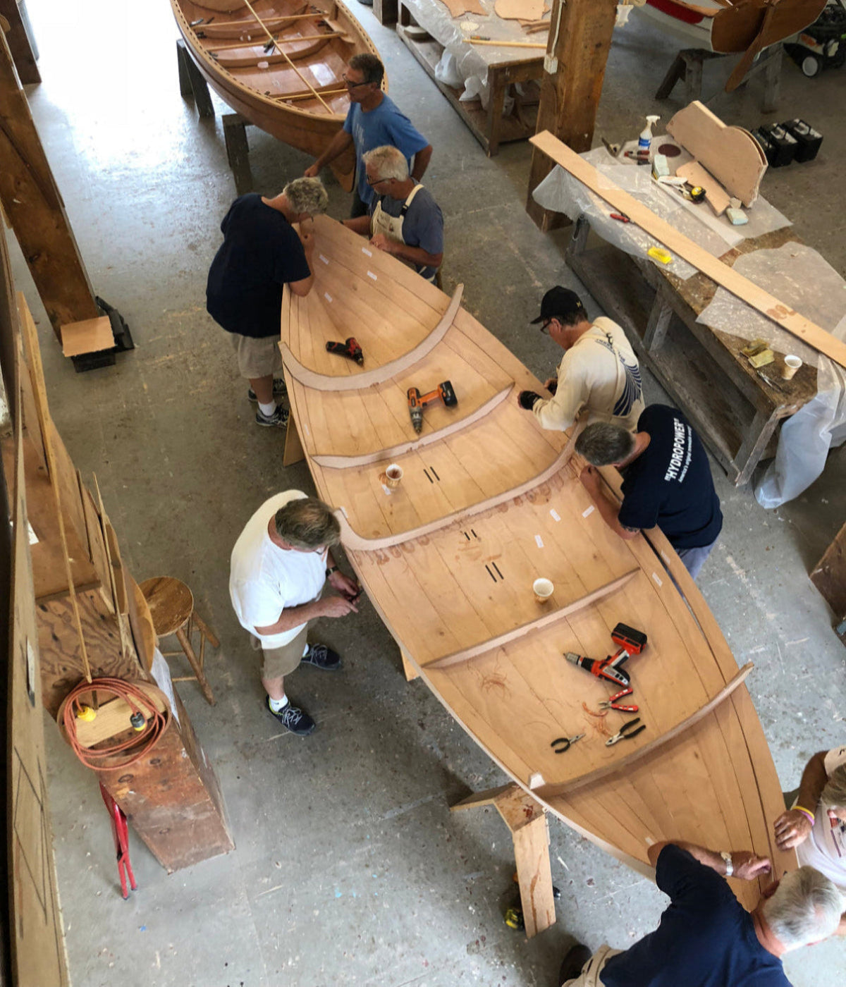 Class building the first Lighthouse Tender Peapod at WoodenBoat School in Brooklin, Maine