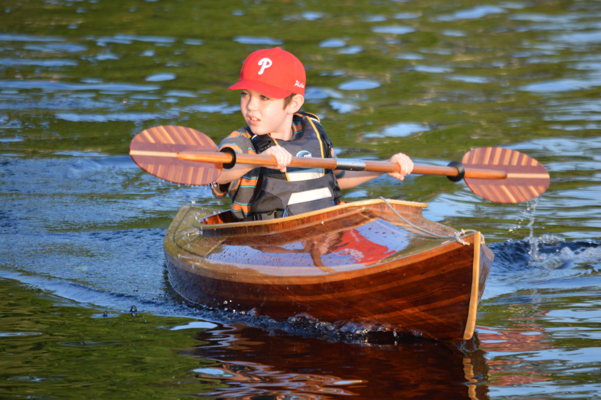 A young paddler enjoying a Little Auk 11 that was built by Bill W.