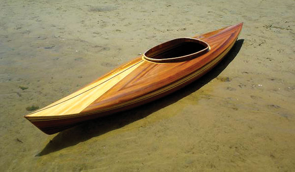 A Little Auk 11 built by Geoff H. pulled up on a beach
