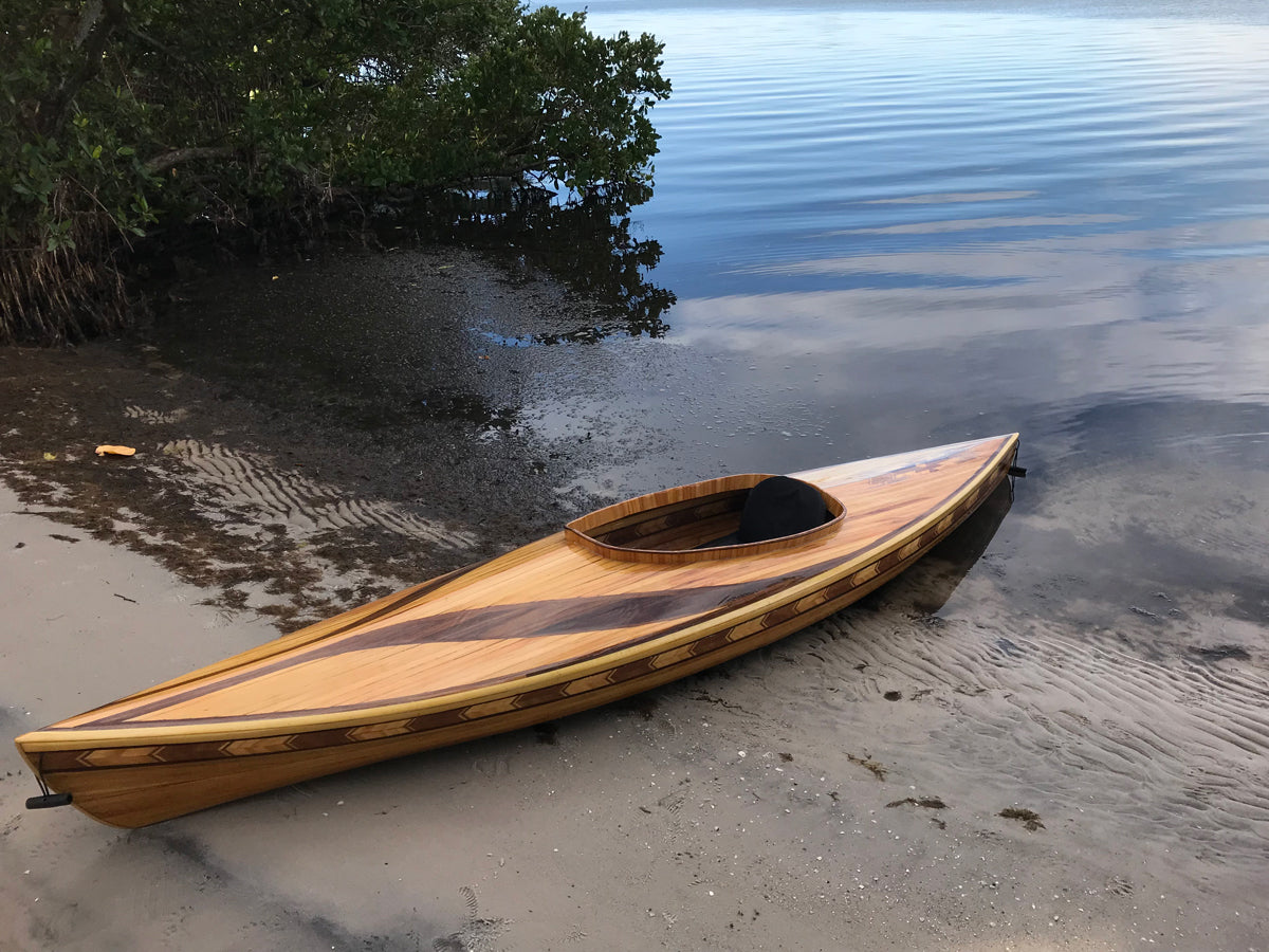 A Little Auk 11 gracing the shore of Lemon Bay, Florida. Jeffrey F. crafted her in cypress with accent inlays.