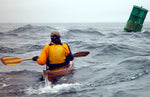 Night Heron being paddled by designer Nick Schade. Photo taken by Carl Tjerandsen. Thumbnail