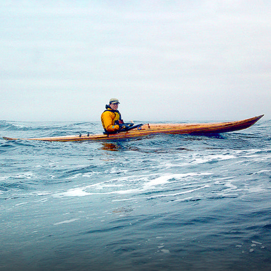 Night Heron being paddled by designer, Nick Schade. Photo taken by Carl Tjerandsen.