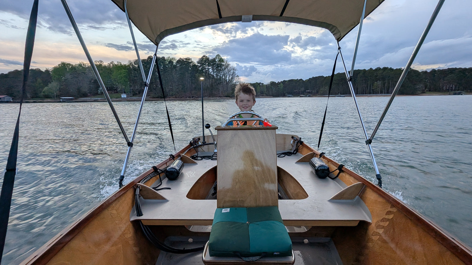 Peeler Skiff with it's Junior Captain at the helm, built by Gray T.