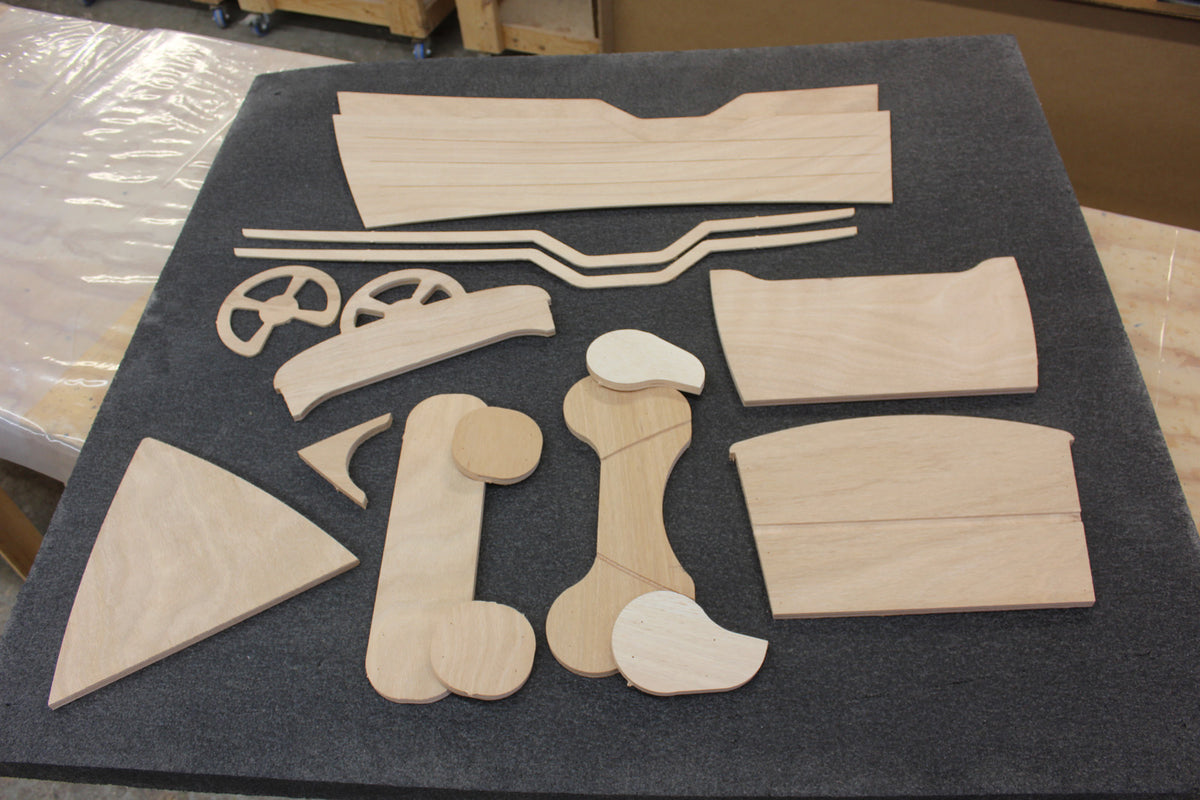 CNC-Cut wood parts of the Rug Runner kit. 