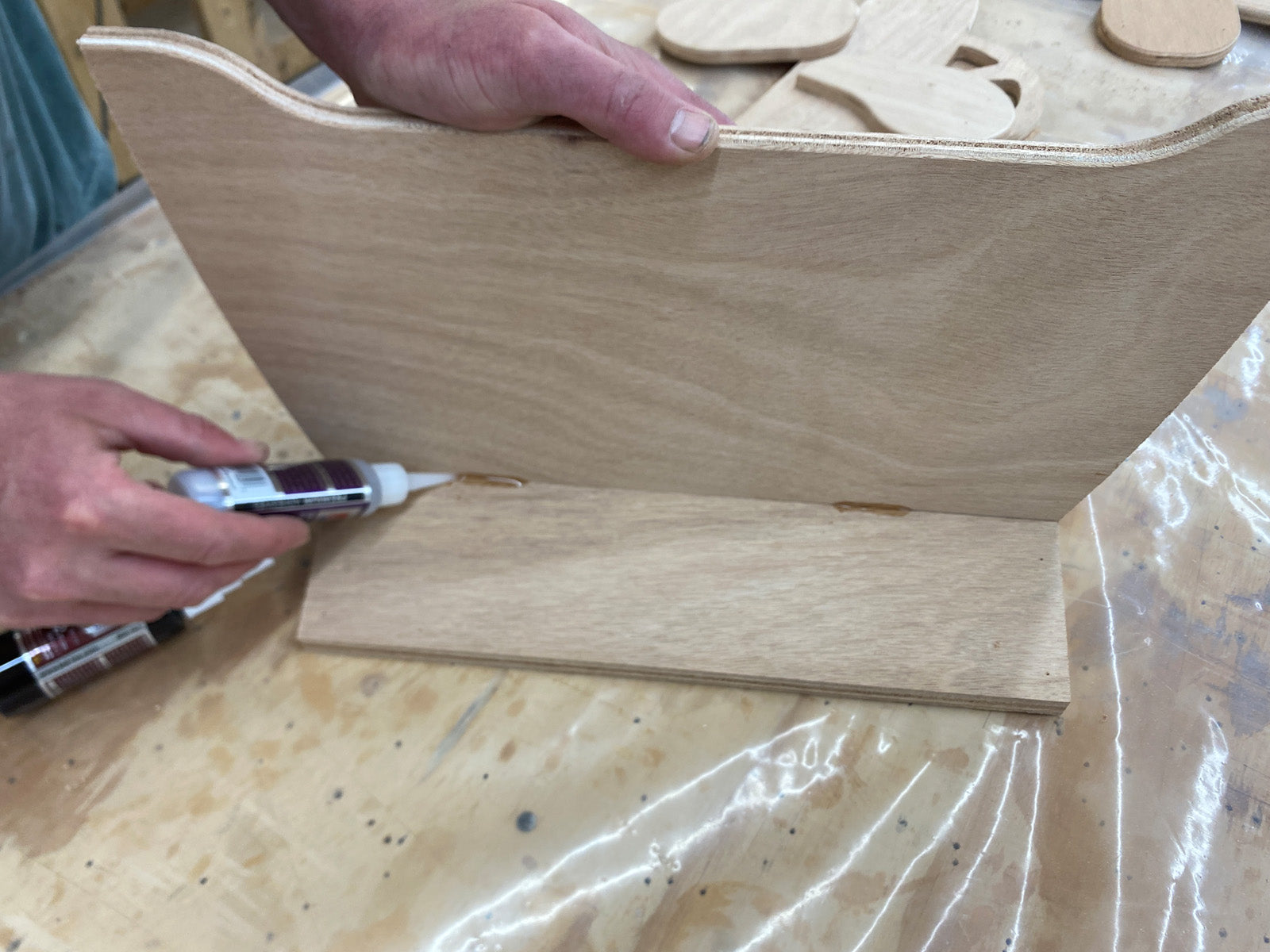Bonding the Seat and Transom parts in the Rug Runner kit with CA Glue.