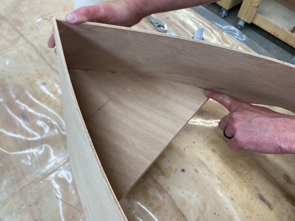 Bonding the foredeck of the Rug Runner kit to the hull panels. 