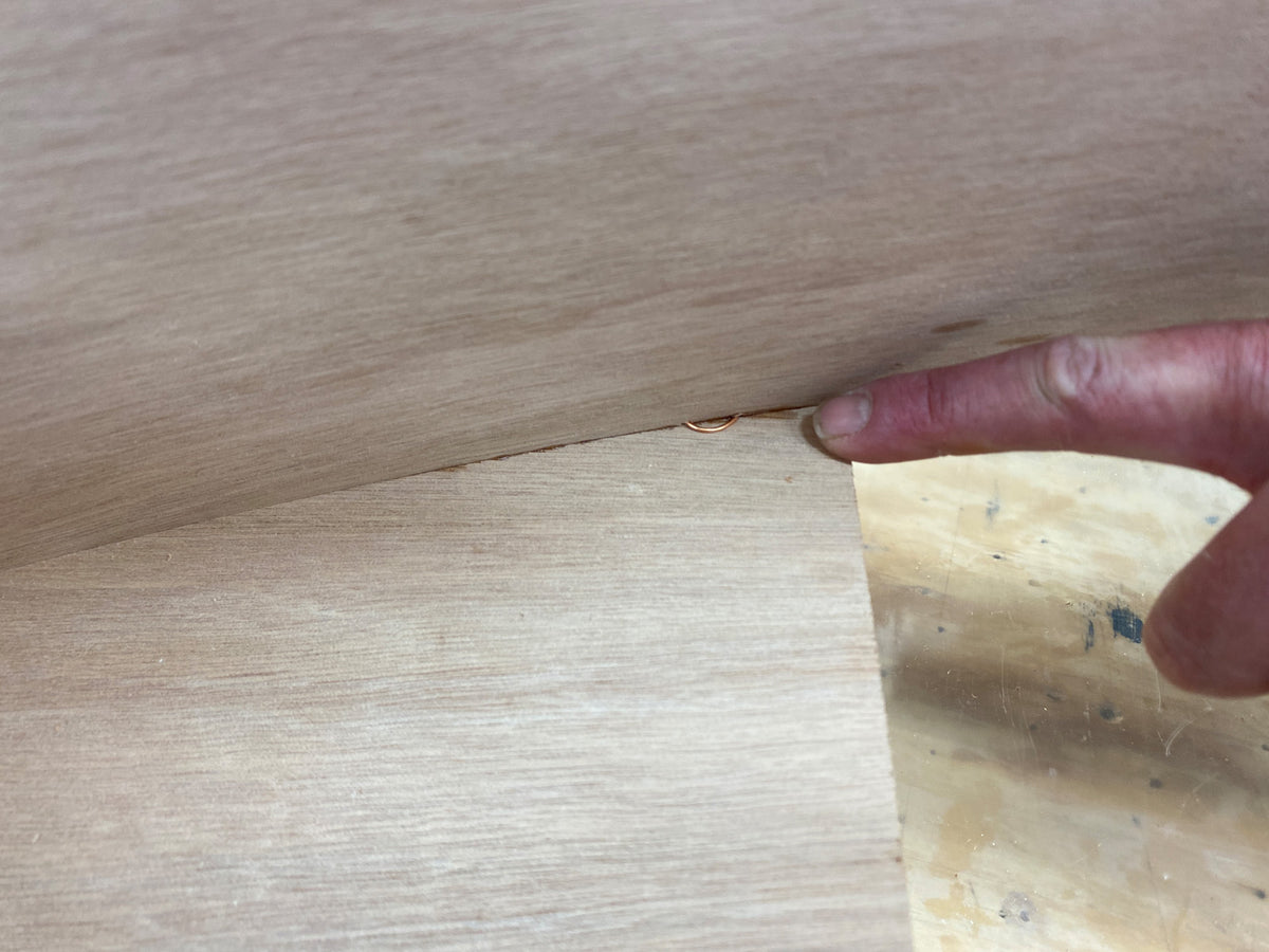 Bonding the seat of the Rug Runner kit to the hull panels and transom. 
