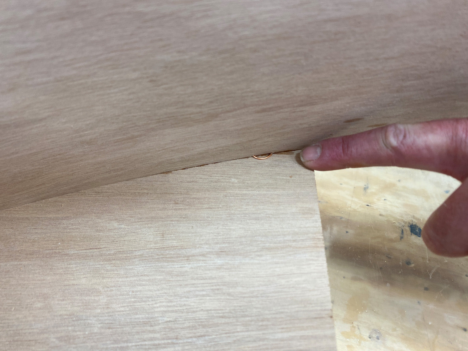 Bonding the seat of the Rug Runner kit to the hull panels and transom. 