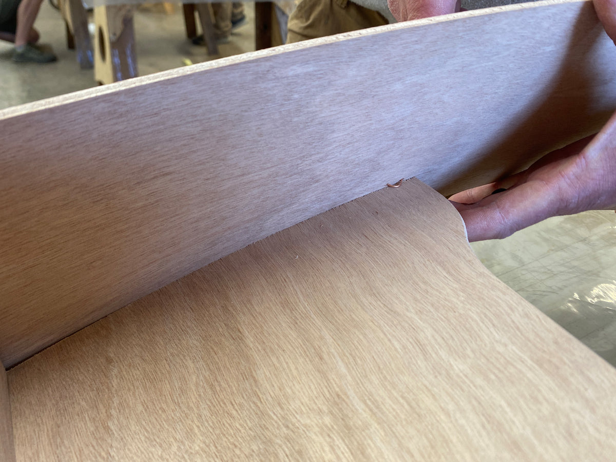 Bonding the seat of the Rug Runner kit to the hull panels and transom. 