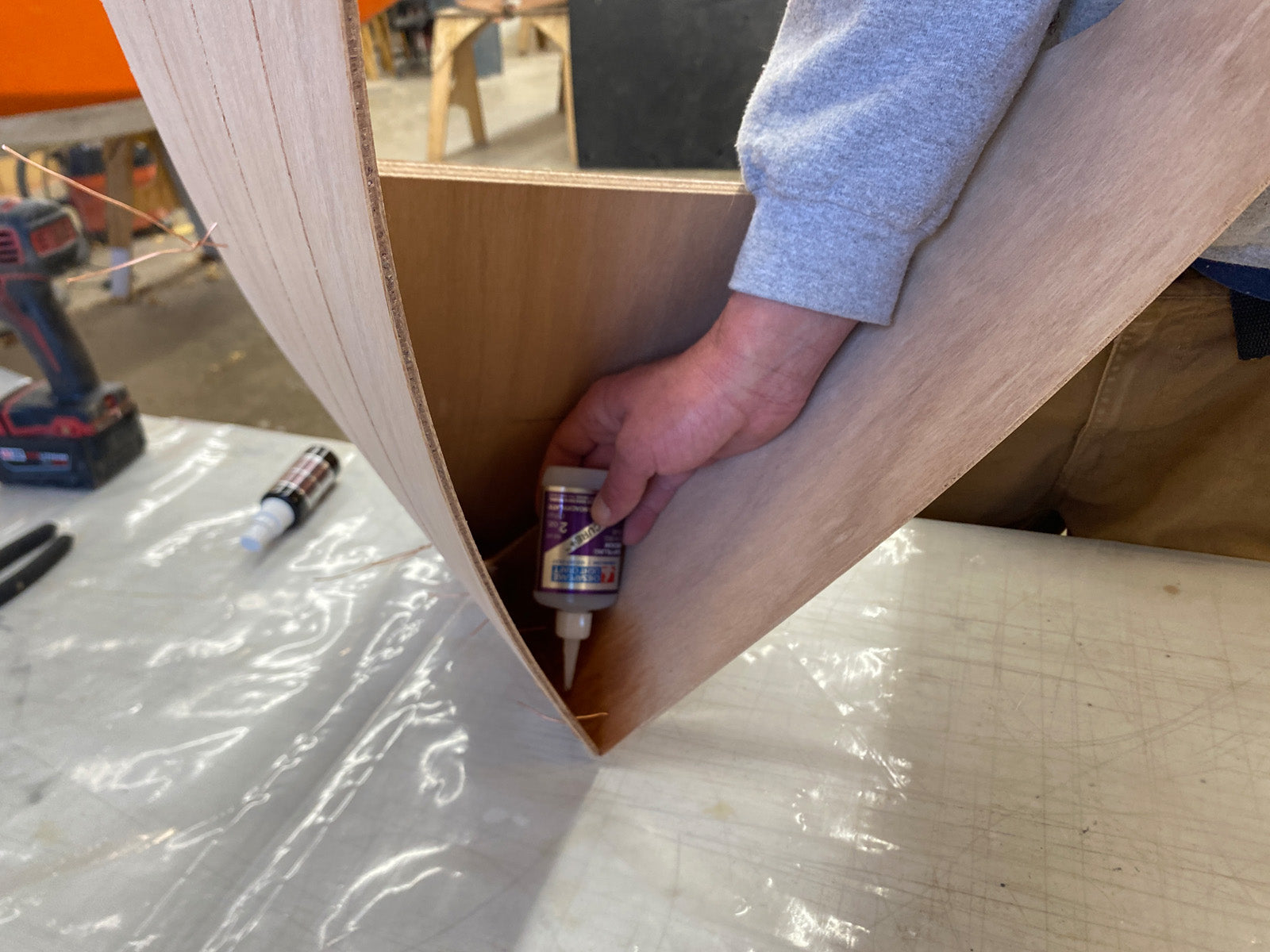 Bonding the foredeck of the Rug Runner kit to the hull panels with CA Glue.