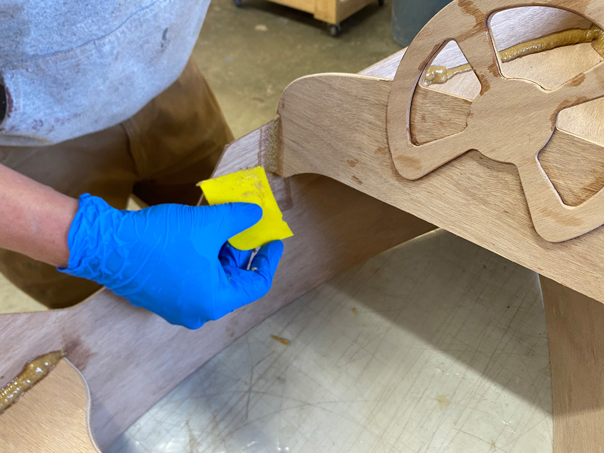 Cleaning up the excess epoxy from the fillets.