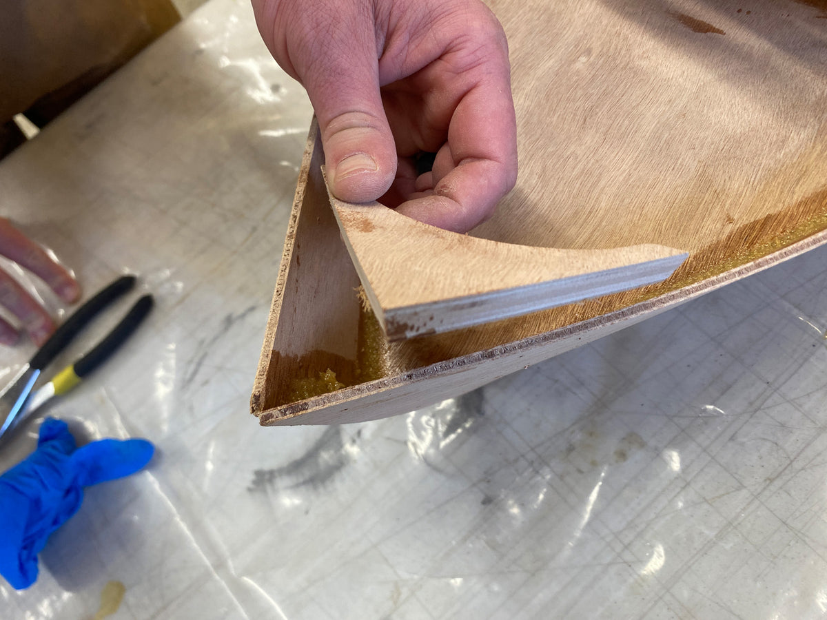 Preparing to install the breasthook in the bow. 