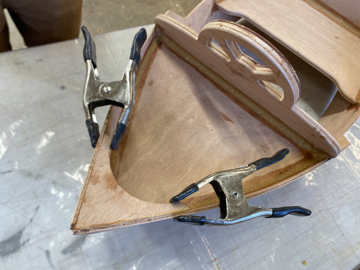 Bonding the breasthook to the bow parts.