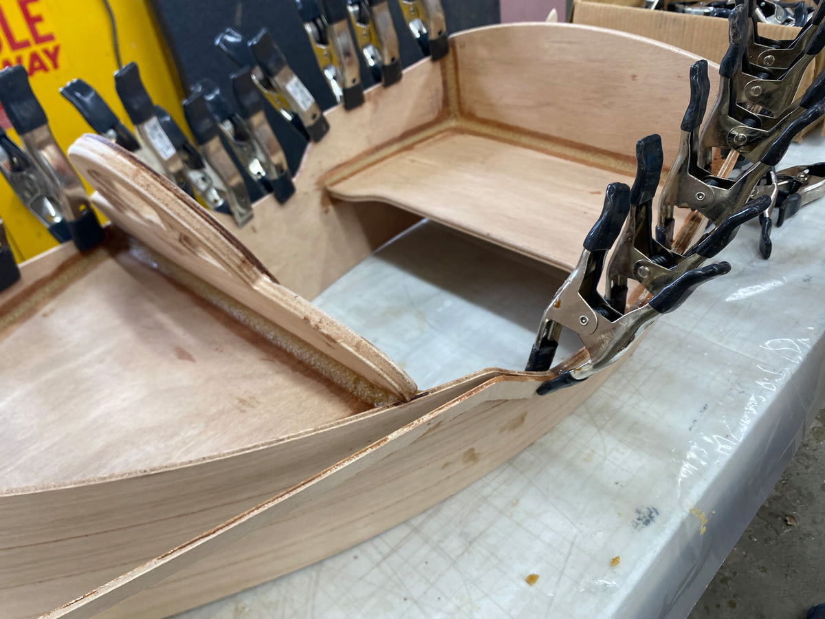 Bonding the outwales to the hull.