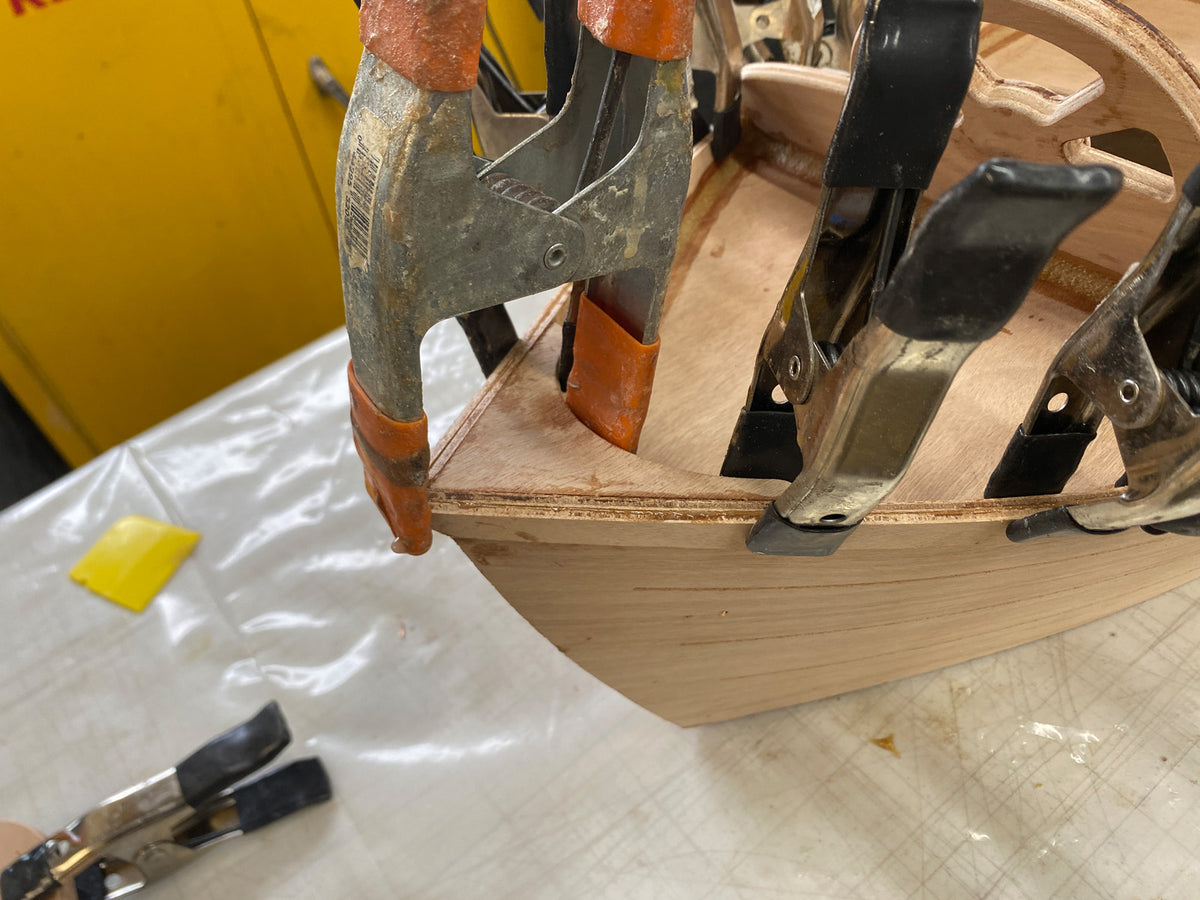 Bonding the outwales to the hull.