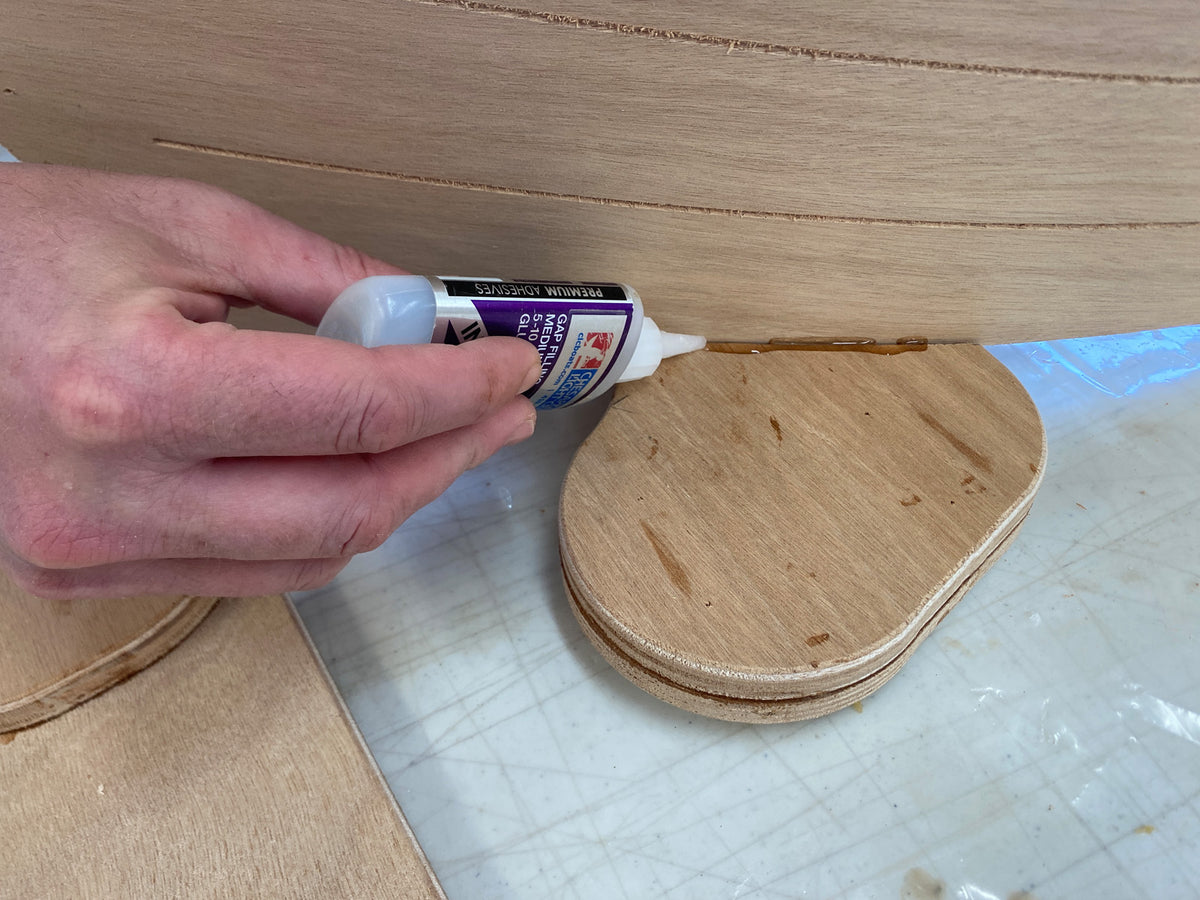 Bonding the caster mounts to the hull.