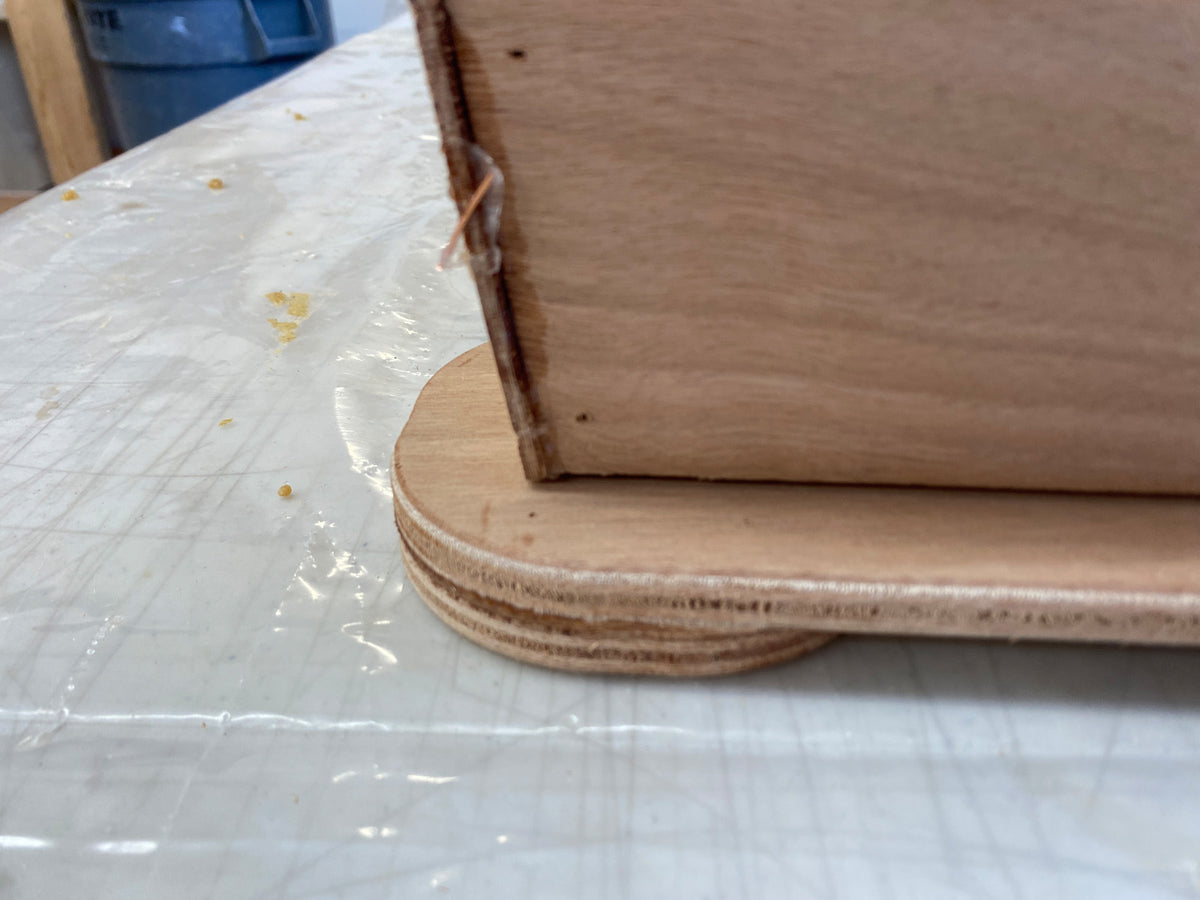 Bonding the caster mounts to the hull.