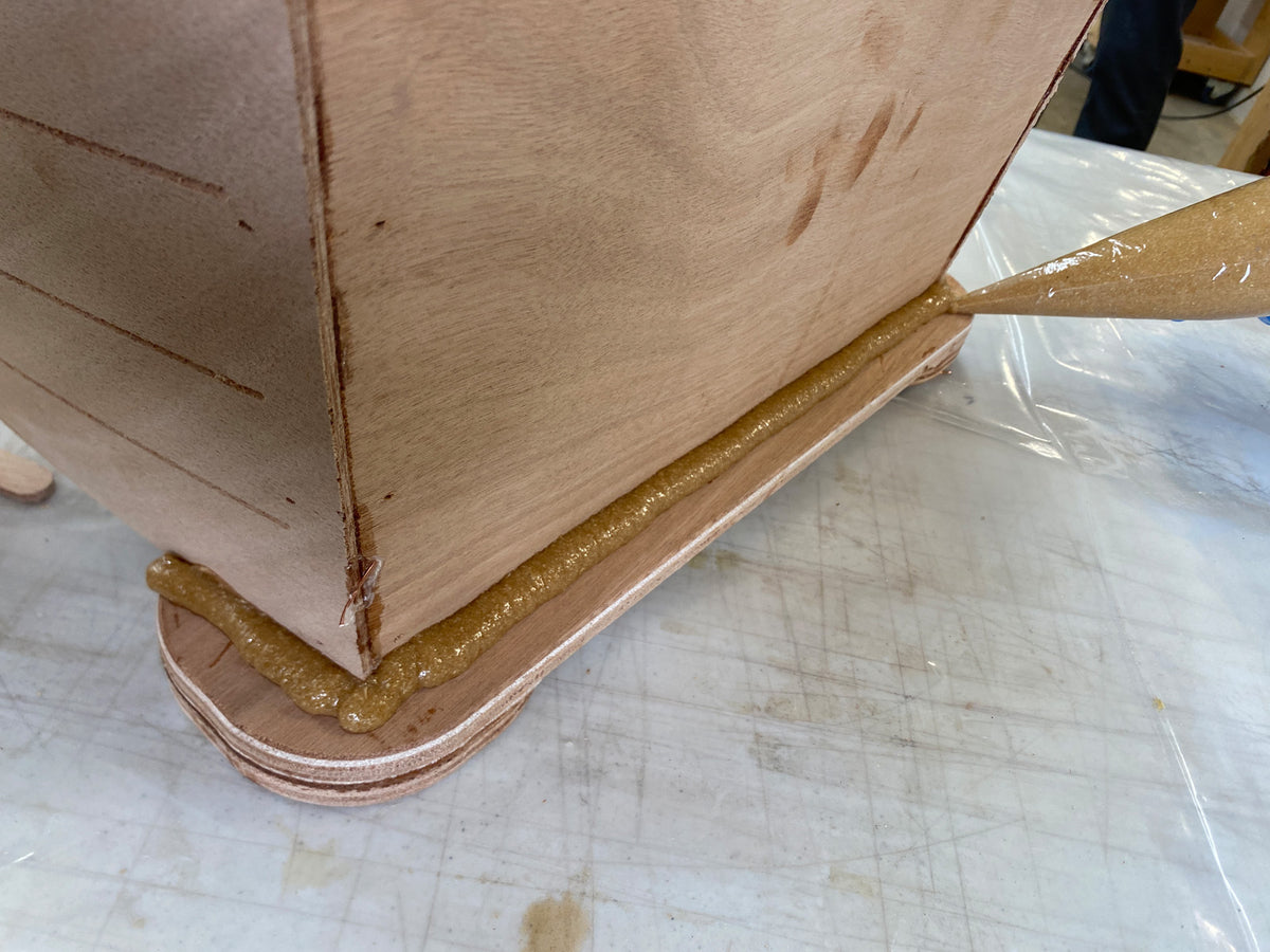 Bonding the caster mounts to the hull.