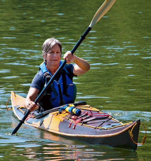 Tanya F. paddling a Stitch-and-Glue Night Heron kayak that she built. 