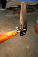 Smart Track Toe Pilot Rudder System being installed on a Guillemot kayak using the V-mount rudder bracket. Thumbnail