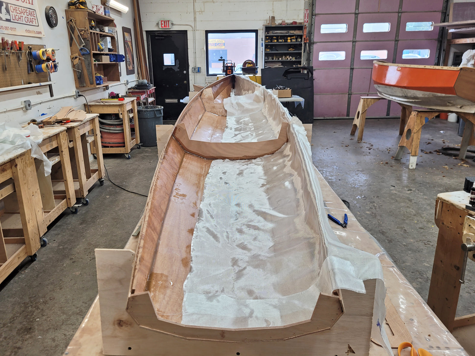 Surge Coastal Rower hull being fiberglassed