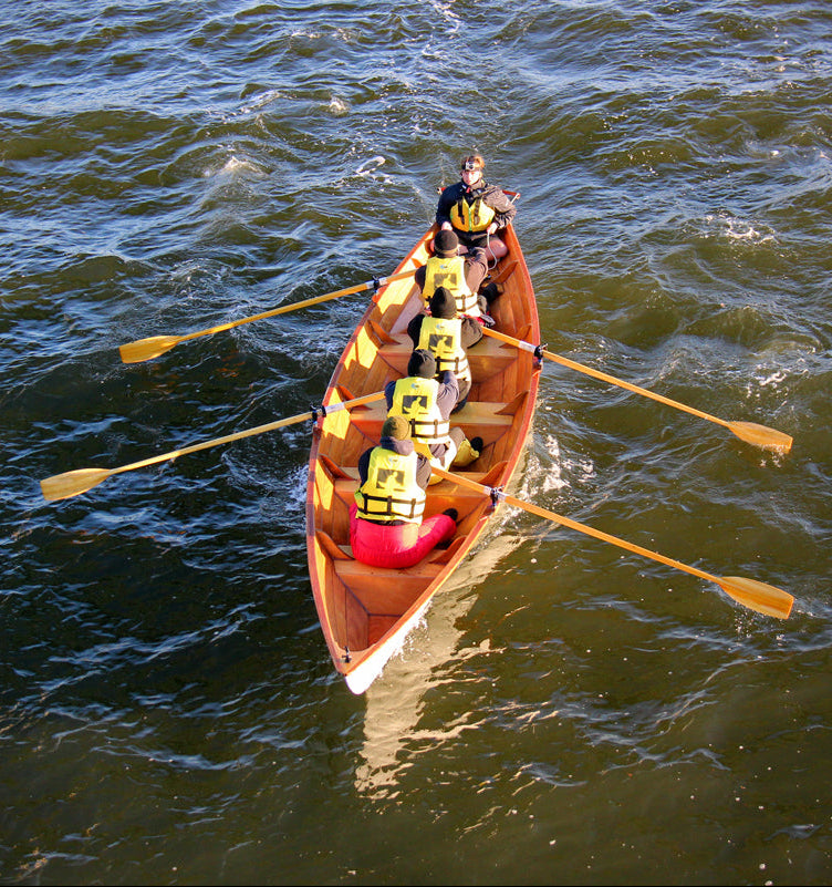 The CLC Rowing Team rowing on the Severn River with Nicky S. as coxswain.