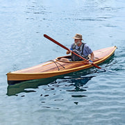 A man paddling a Wood Duck 12 hybrid kayak