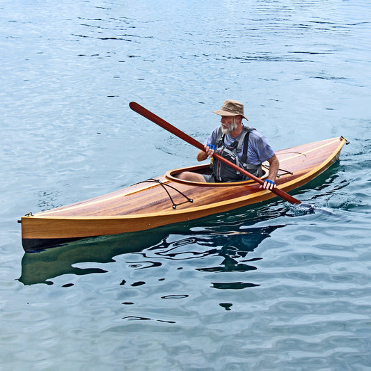 A man paddling a Wood Duck 12 hybrid kayak