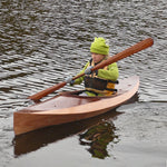 A kid out for a paddle in a Wood Duckling 8 kayak Thumbnail