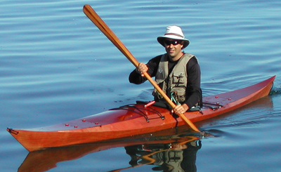 Eric Schade in a Shearwater 17 with a Greenland Paddle
